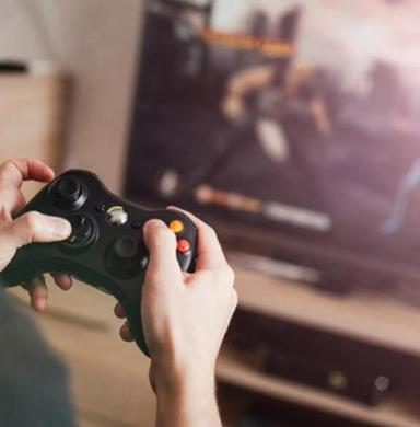 Photo of hands with video game controller