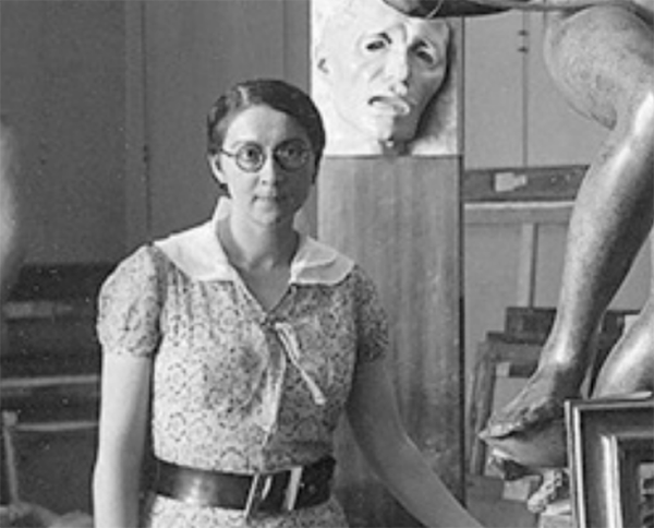 Rose Valland poses with sculptures and canvases.