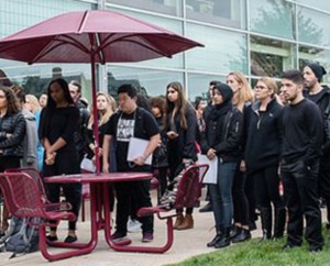 Students gather at the Free Speech wall in October 2017 for a "Take a Knee" event hosted by the Social Justice Advocacy group on campus