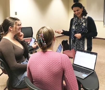 A woman teaches a class.