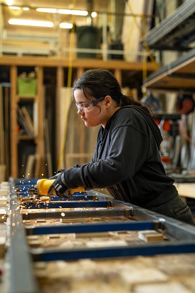 Marleigh Hickey welds a ladder.