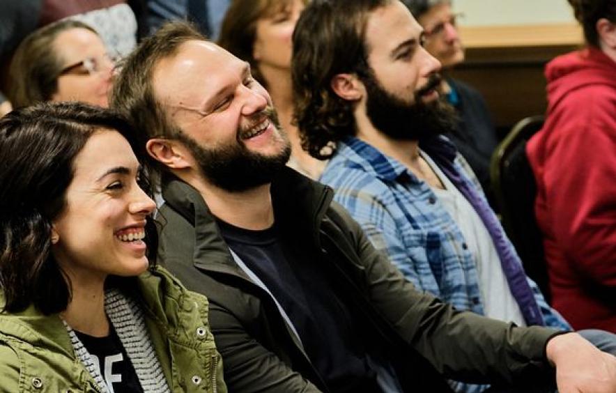 audience laughs during theatre workshop performance
