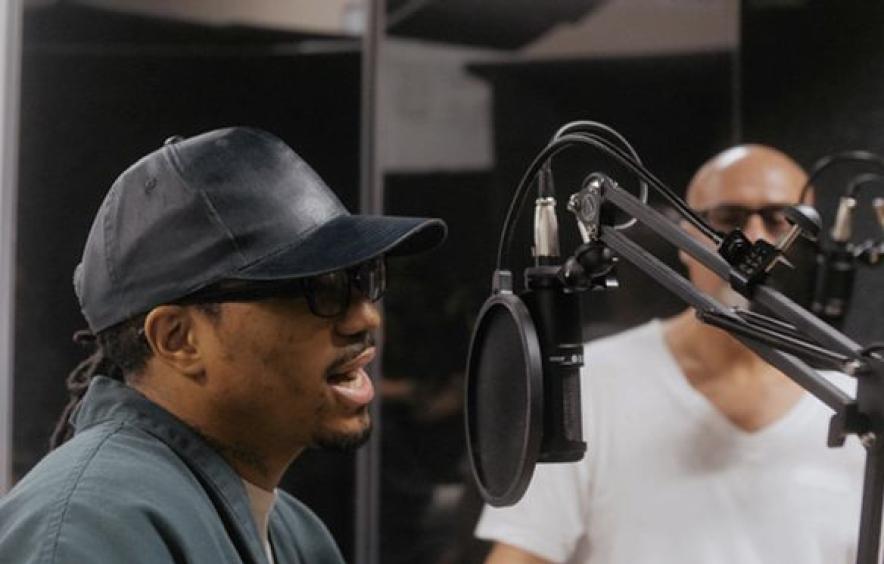 man speaking into a mic