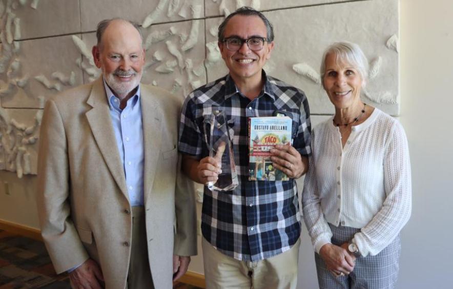 three people smiling