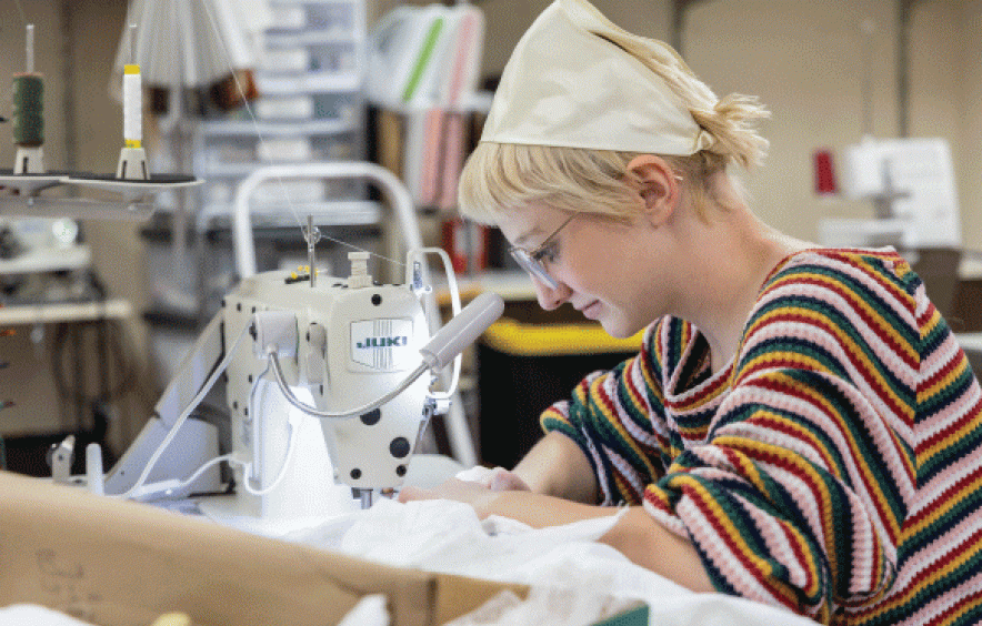 Theatre student in costume shop.