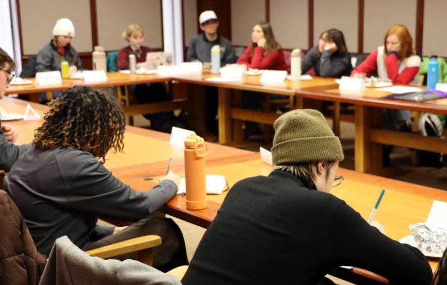 Students writing in a classroom