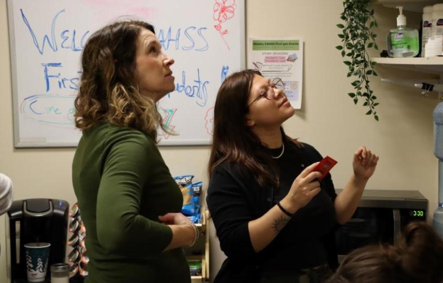 Susan talking to a student