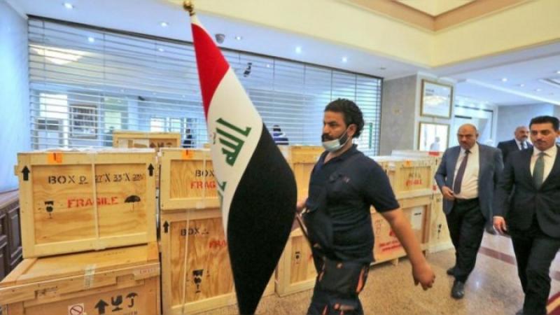 Staff at the Ministry of Foreign Affairs in Baghdad prepare for a handover ceremony of returned antiquities on August 3, 2021. Credit: AFP Photo