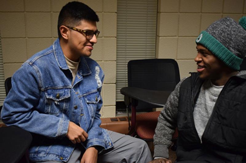 Issac Vargas (left) and James Artis laugh together at a BSA meeting