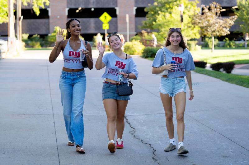 Students walking, waving and smiling