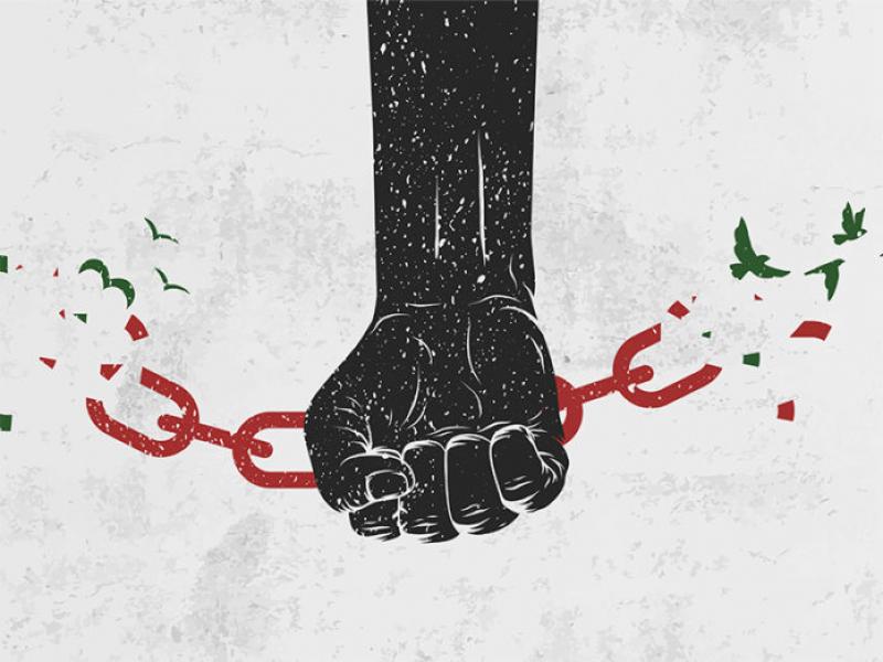 Juneteenth graphic of fist with chains