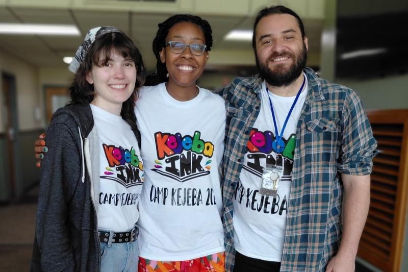 three people smiling together
