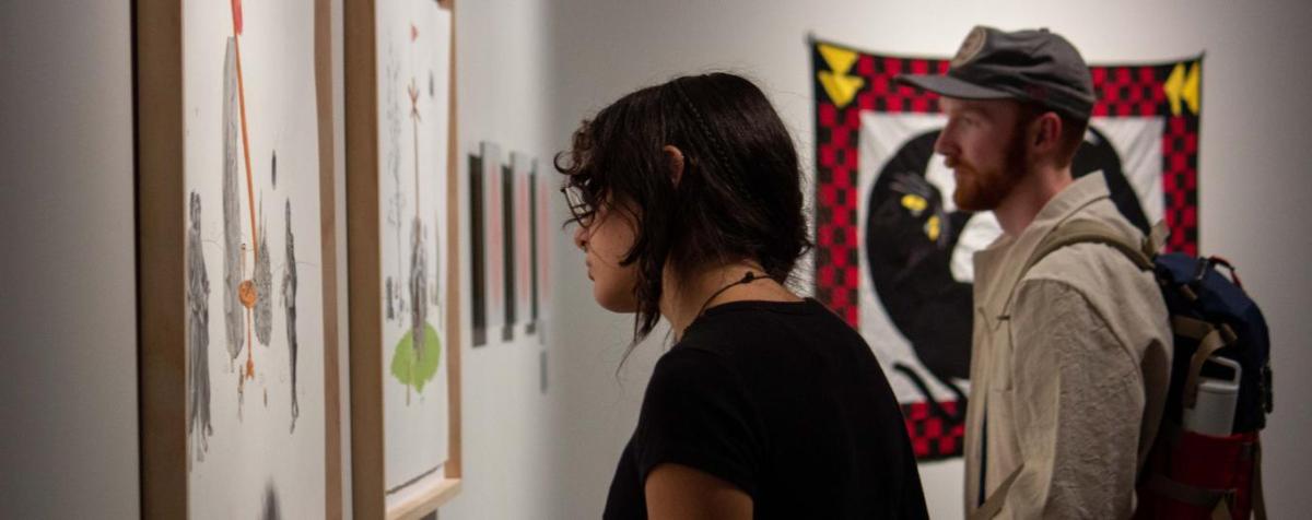 students view faculty work in the Vicki Myhren Gallery