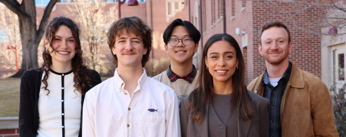 The entire lab team smiling together