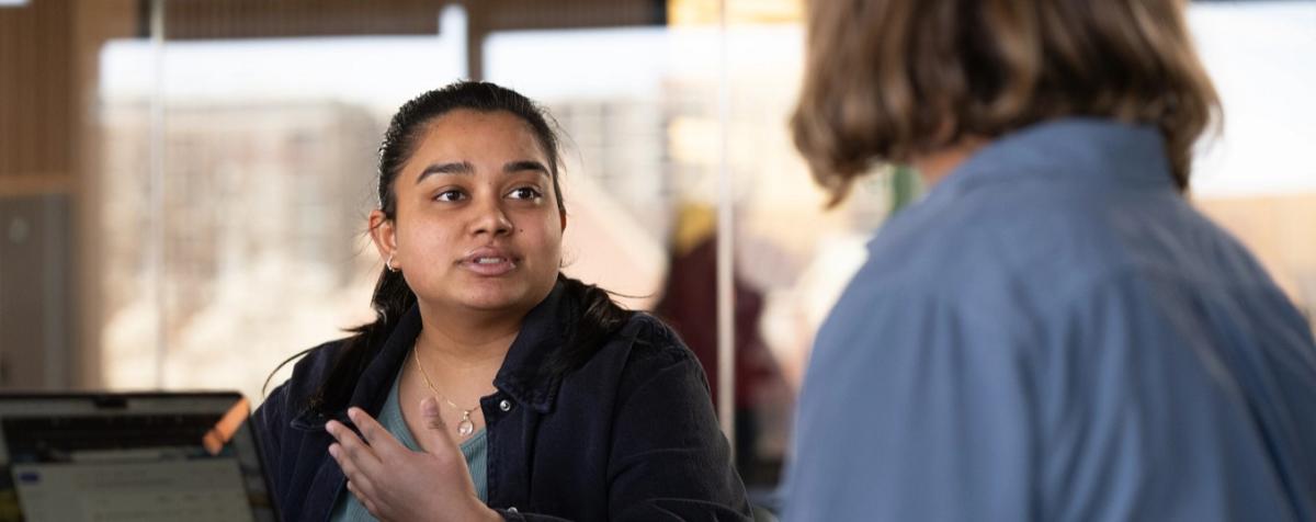 A student talking with someone.