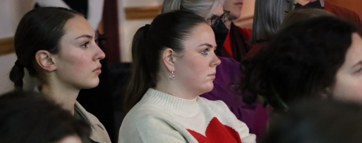 two girls listening to a lecture