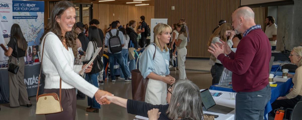 Student shaking hands with someone