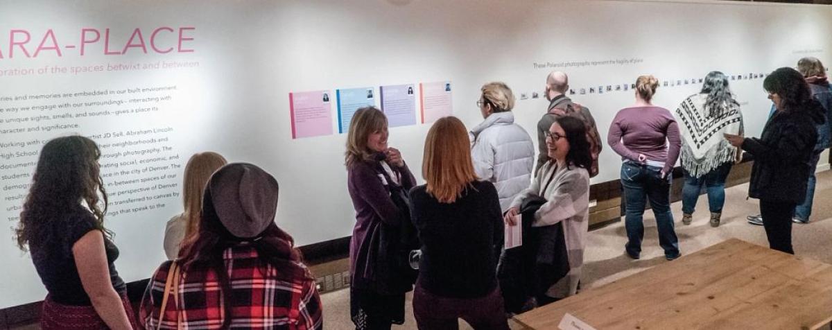 people in anthropology museum exhibit