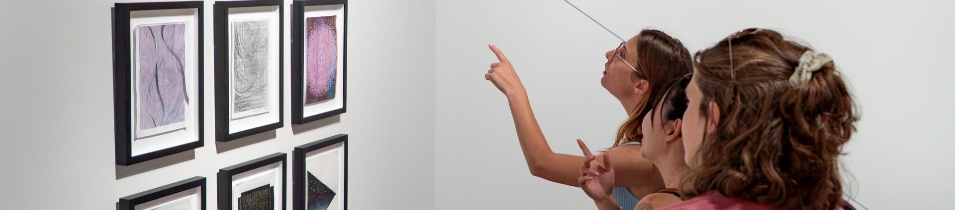 students looking at art