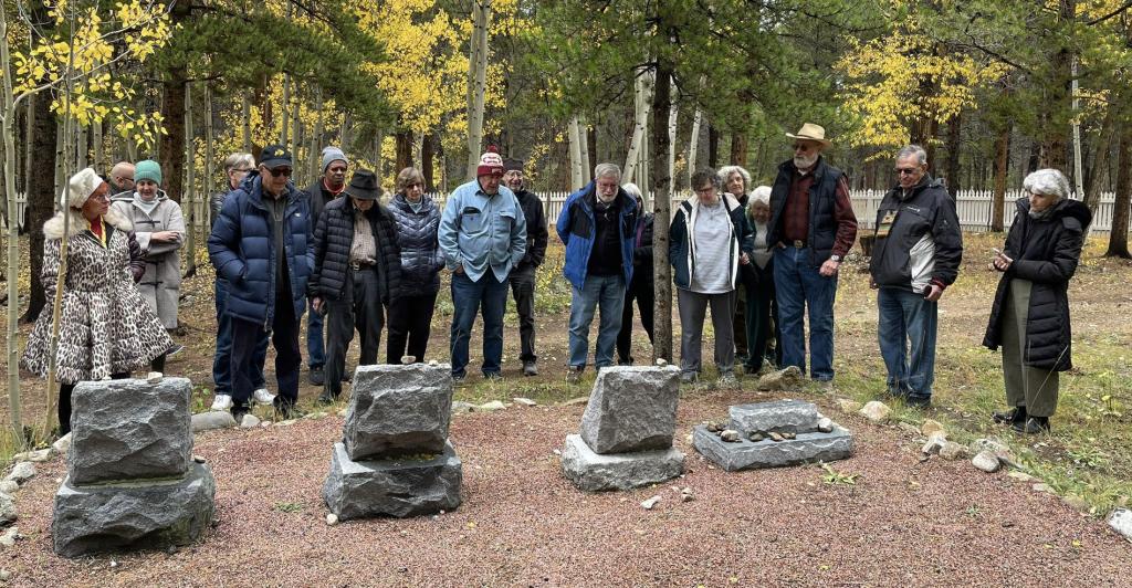 folks looking at headstones