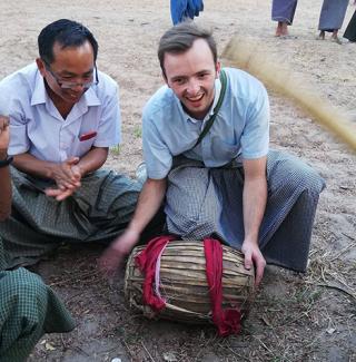 Kip Hagberg holds a drum during his time with the Peace Corps