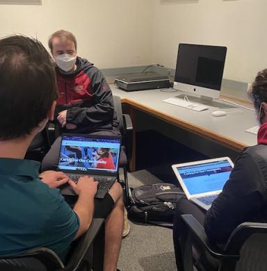 Three students sit in a Social Media class.