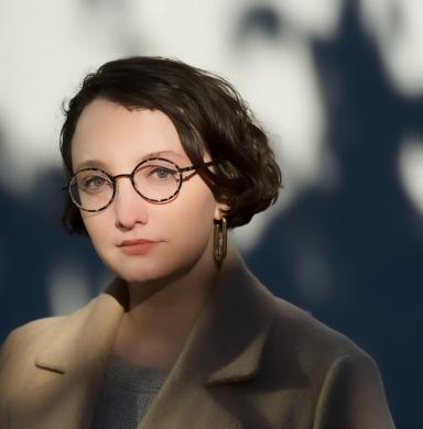 A woman looks at the camera with lots of shadows around her.
