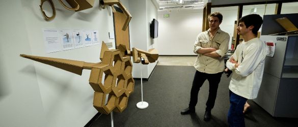 students looking at art projects