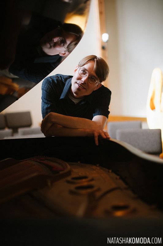 Chappell Kingsland leaning on piano