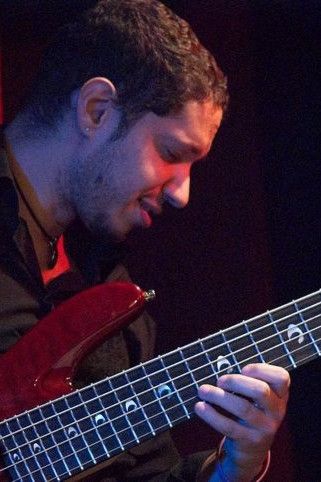 Eduardo "Bijoux" Barbosa playing the electric bass