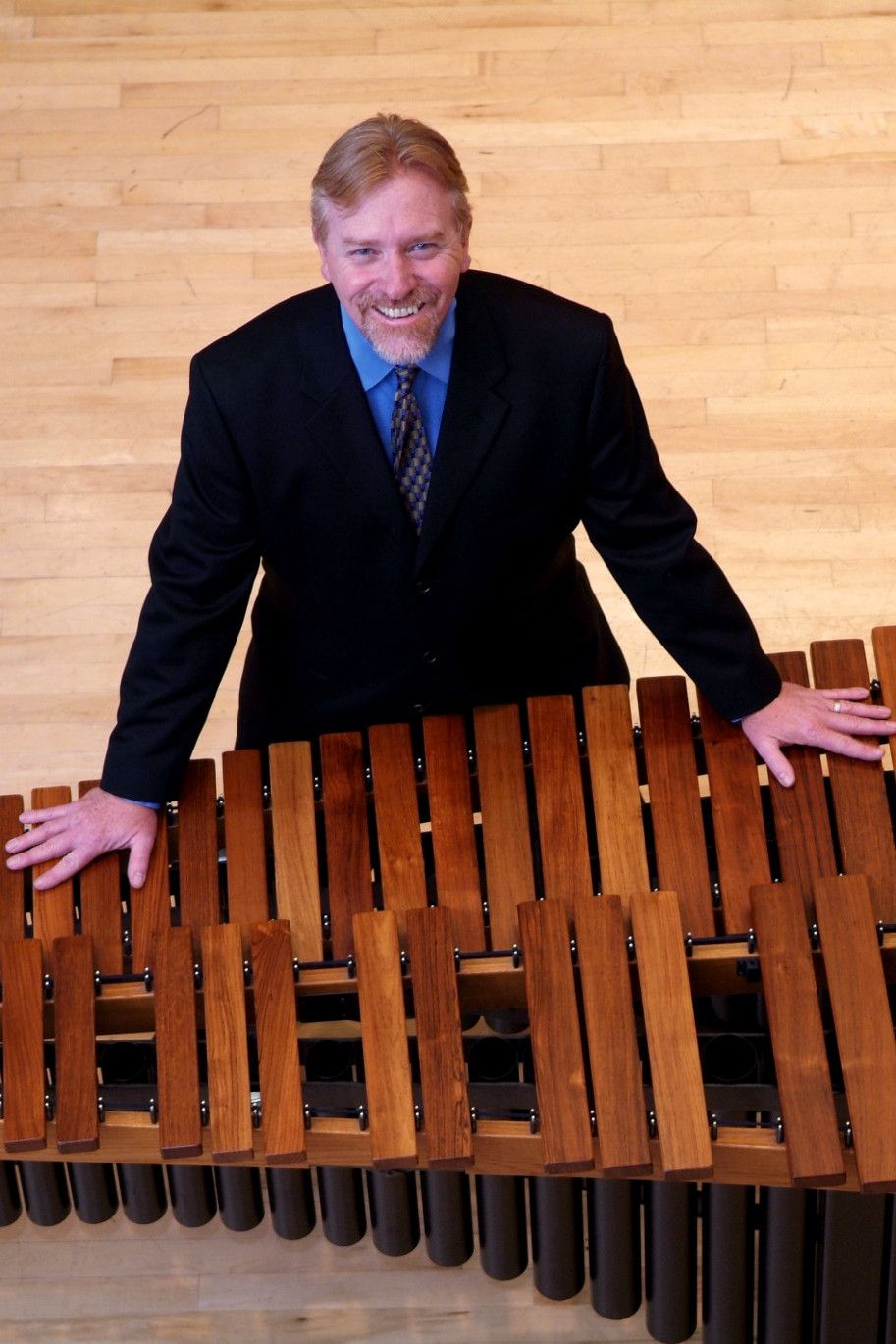 John Kinzie leaning on xylophone