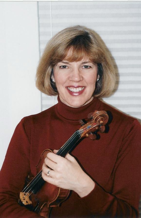Kathleen Spring holding a violin