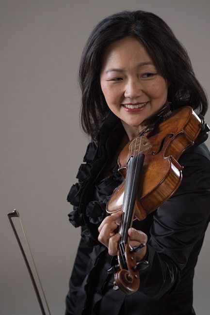 Yumi Hwang Williams holding a violin